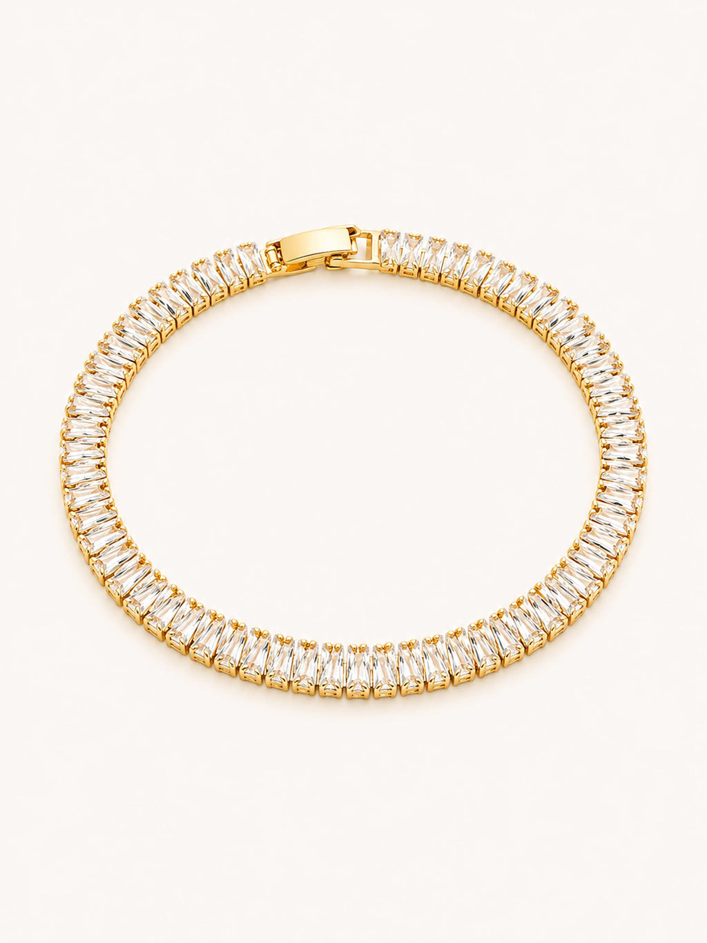Gold baguette CZ tennis bracelet with an elegant continuous stone design.