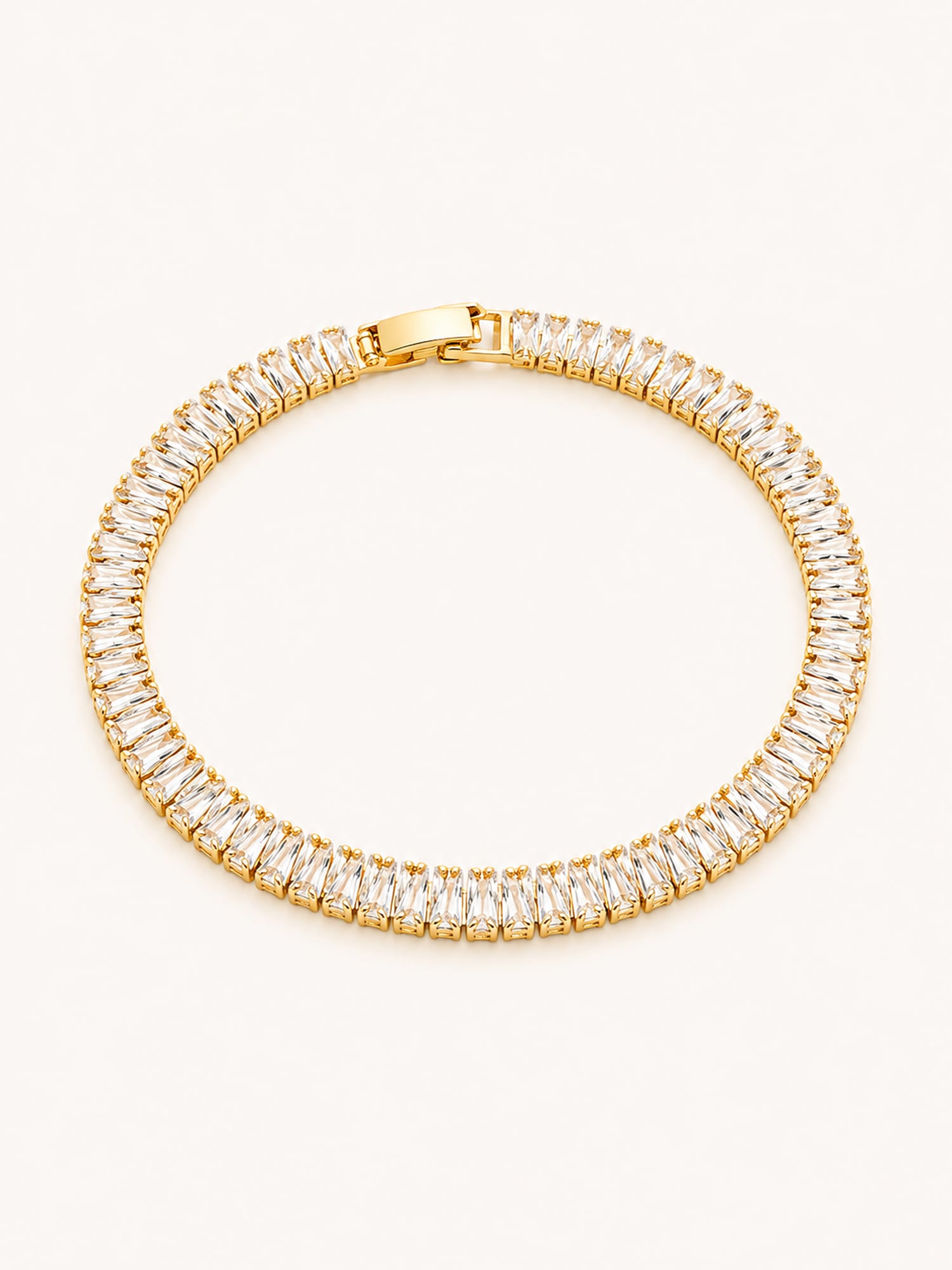 Gold baguette CZ tennis bracelet with an elegant continuous stone design.