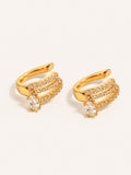 Gold triple row ear cuff earrings with clear oval cubic zirconia and pavé detailing in stainless steel.