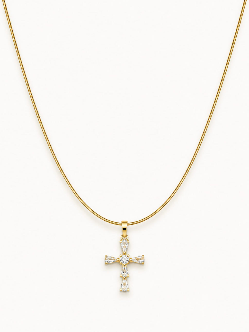 Gold snake chain necklace featuring a sparkling CZ cross pendant with white stones.