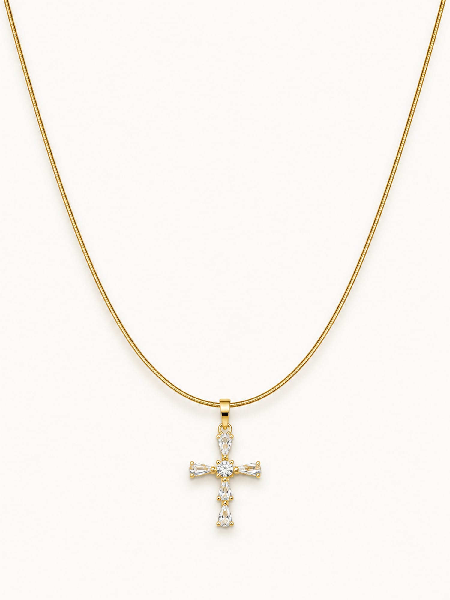 Gold snake chain necklace featuring a sparkling CZ cross pendant with white stones.