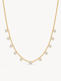 Dainty round CZ station necklace in 18K gold plated stainless steel with evenly spaced sparkling stones.