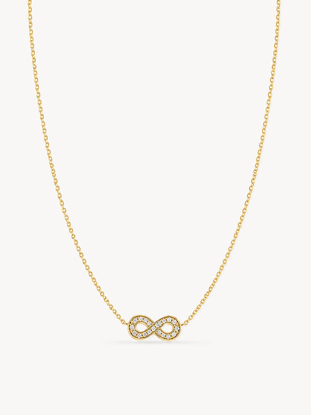 Minimalist infinity necklace featuring sparkling white CZ stones in a polished gold finish.
