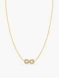 Minimalist infinity necklace featuring sparkling white CZ stones in a polished gold finish.