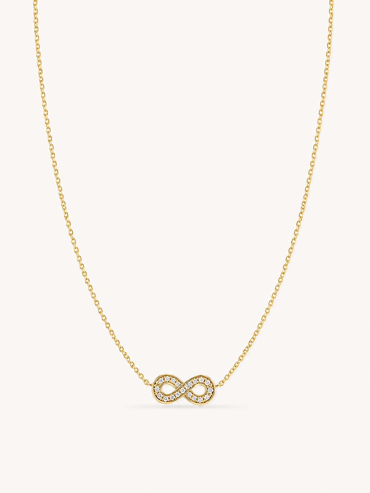 Minimalist infinity necklace featuring sparkling white CZ stones in a polished gold finish.