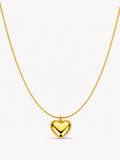 Puffy heart pendant necklace in 18K gold plated stainless steel featuring a polished heart charm on a sleek snake chain.