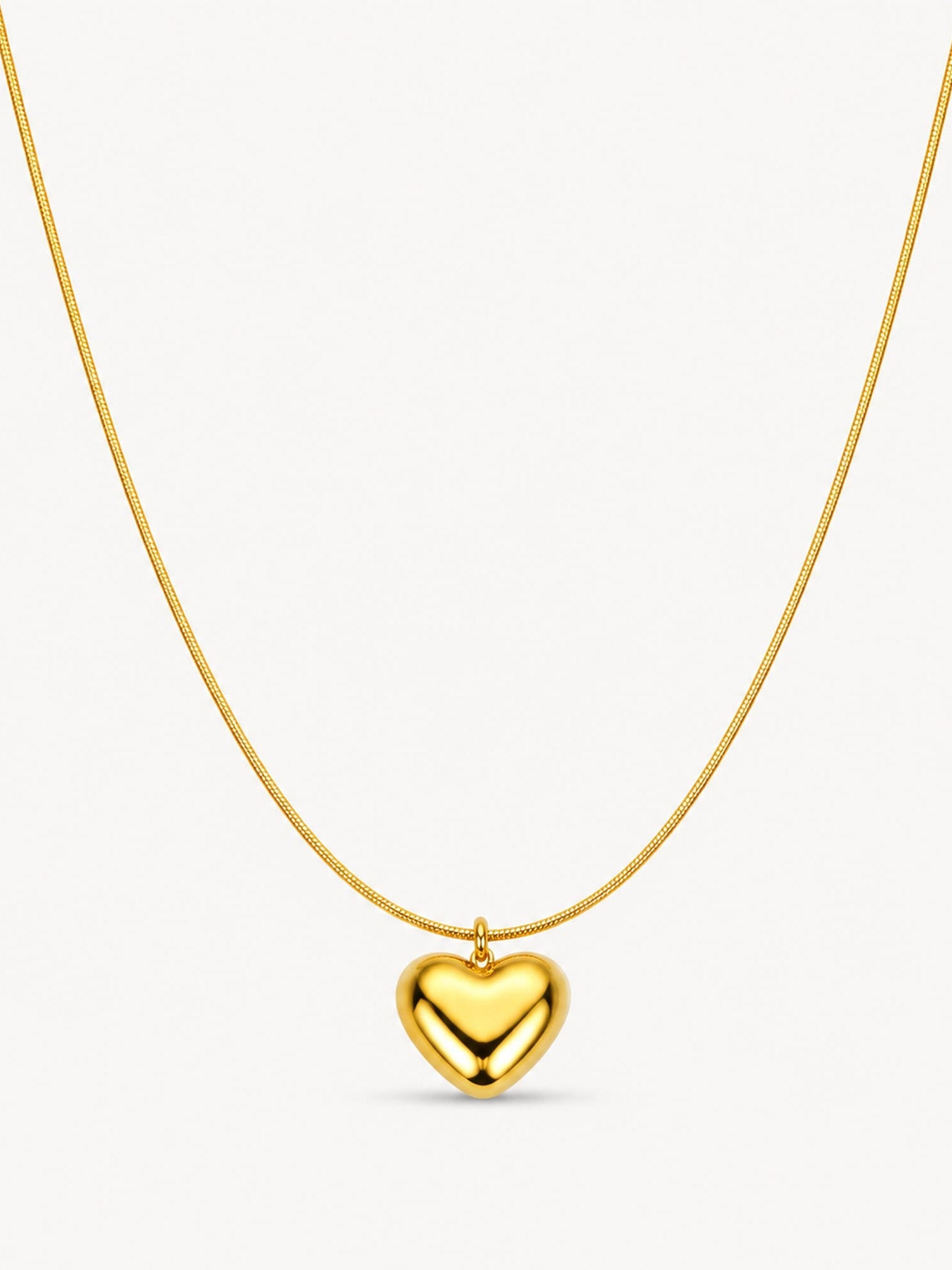 Puffy heart pendant necklace in 18K gold plated stainless steel featuring a polished heart charm on a sleek snake chain.